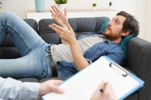 man on couch in alcohol addiction treatment program in Los Angeles