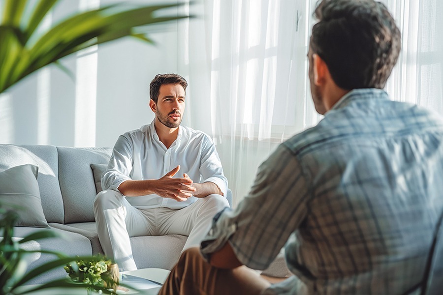 man in therapy discussing pink cloud syndrome and long-term sobriety