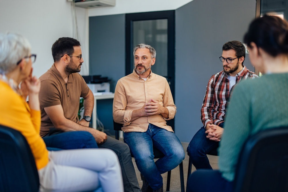 group therapy discussing why honesty is vital for successful recovery