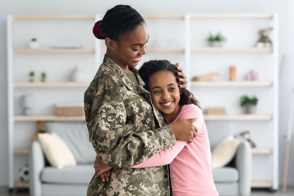 veteran hugging her daughter during TRICARE support