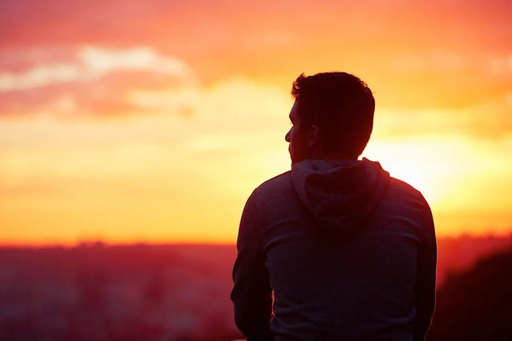 man at sunset learning ways to stay sober and handle cravings