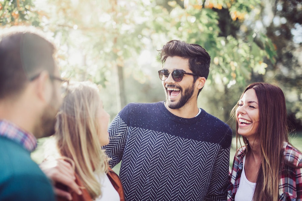 a group of friends smiling and laughing