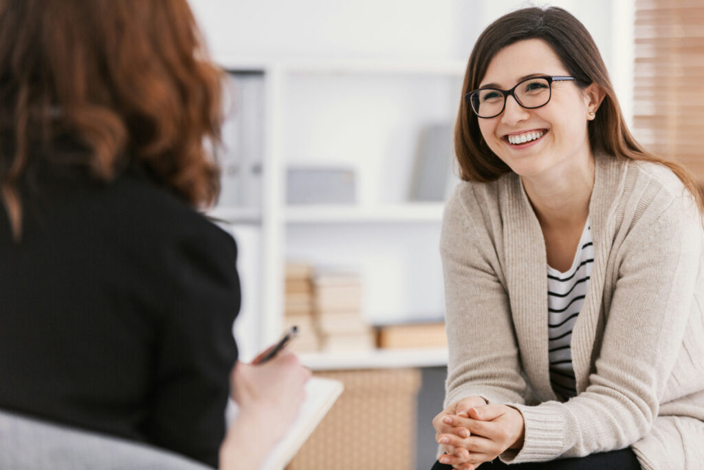 a-woman-smiling-at-therapist