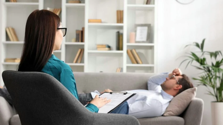 man lying on a sofa during consultation for fight-or-flight