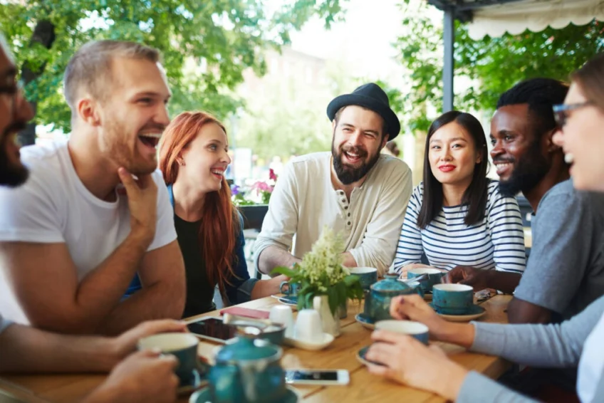 group in circle drinking tea, discussing day drinking