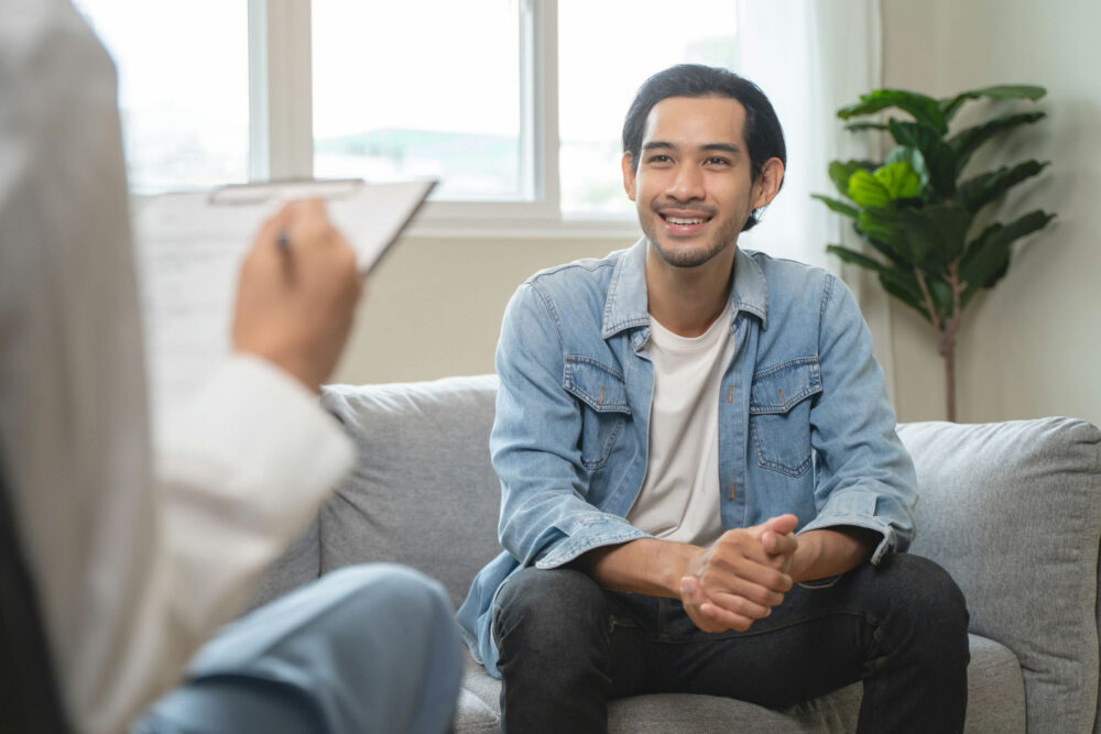 a-man-smiling-in-individual-therapy
