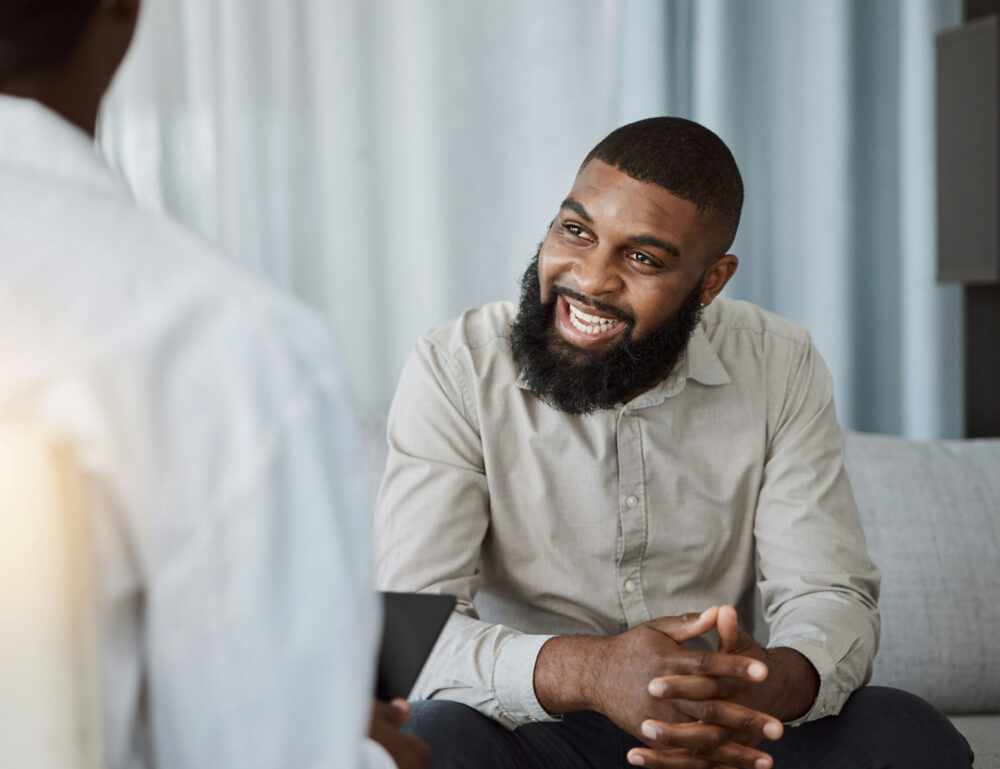 a-man-smiling-in-his-individual-therapy-session