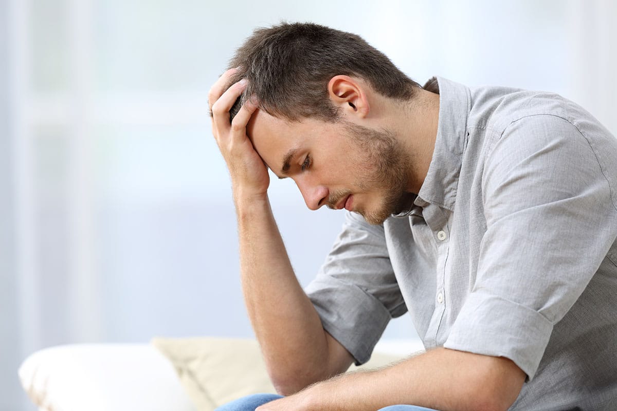 a man thinking about the myths of relapse