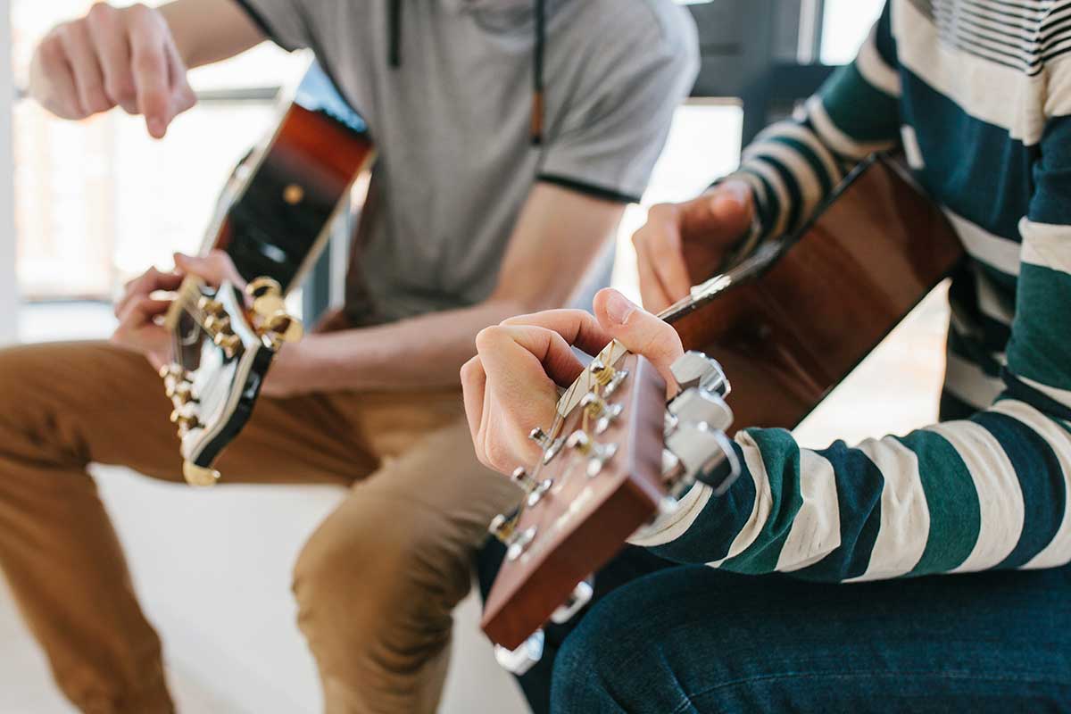 two people participate in a music therapy program