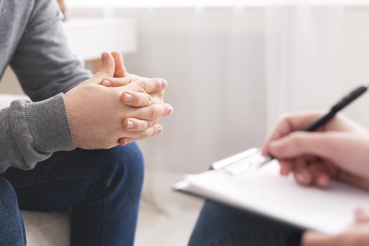 man meets with doctor for medication-assisted treatment for opioid cravings