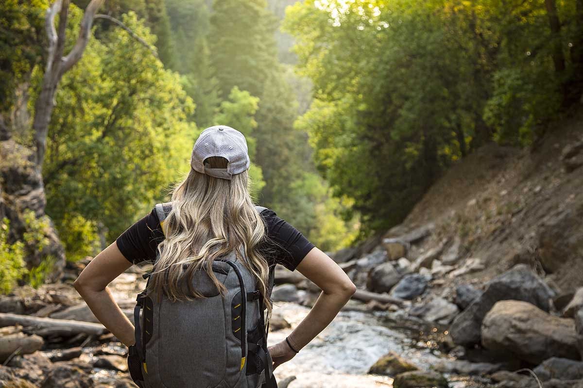 a woman thinks about wilderness therapy for addiction as she takes part in wilderness therapy programs