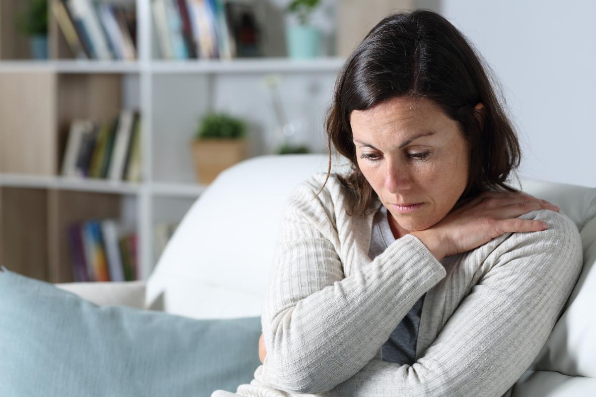 woman sitting and undergoing treatment for opiate addiction