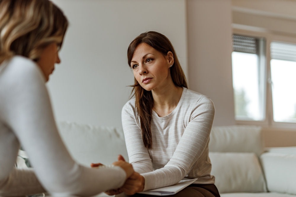 living-with-high-functioning-depression a woman being comforted in therapy