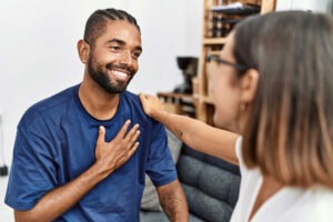 a-man-being-comforted-by-therapist